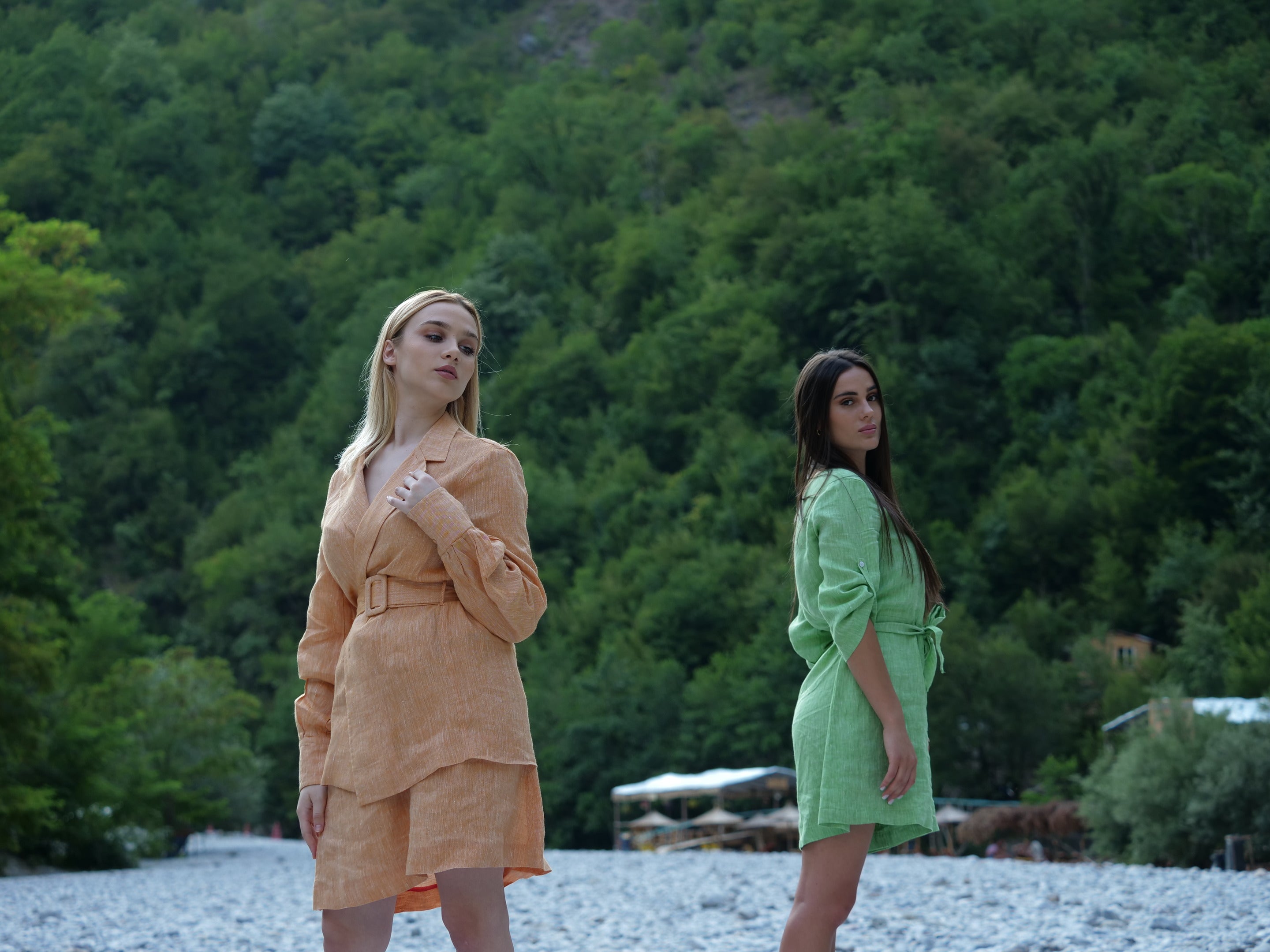 women in orange and green outfits